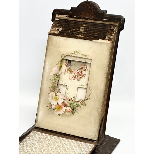 345 - A Victorian leather and hand painted photo album. 26x13x38cm