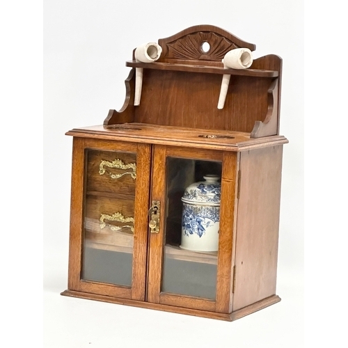 84 - A late Victorian oak humidor. 28.5x18x41.5cm