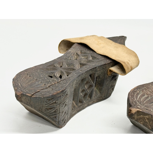 356E - A pair of late 19th century Far Eastern Burmese clogs. 24x9x6.5cm