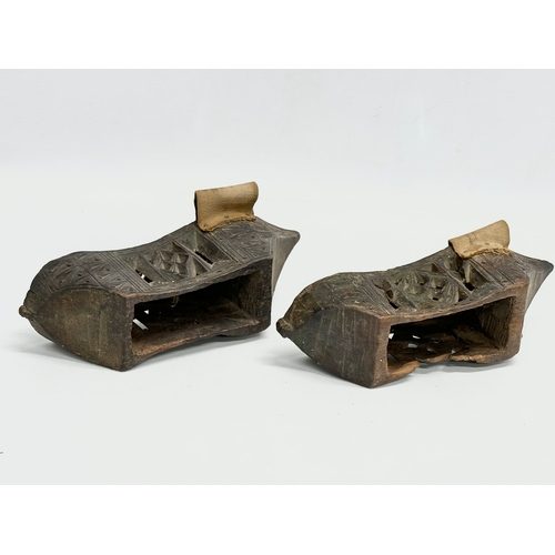 356E - A pair of late 19th century Far Eastern Burmese clogs. 24x9x6.5cm