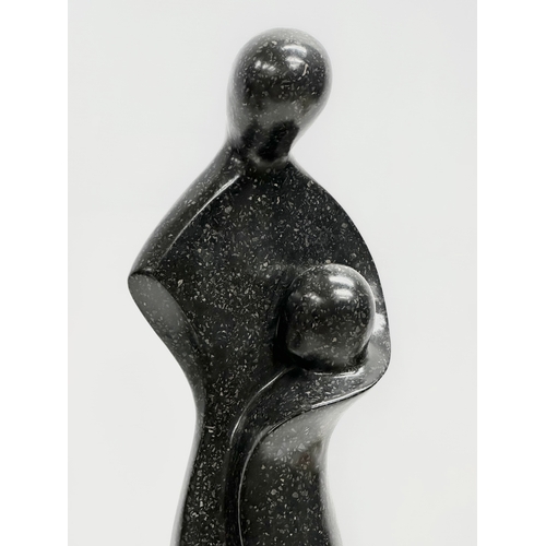 356H - A large Basalt figure in the manner of Henry Moore. 14.5x13x62cm