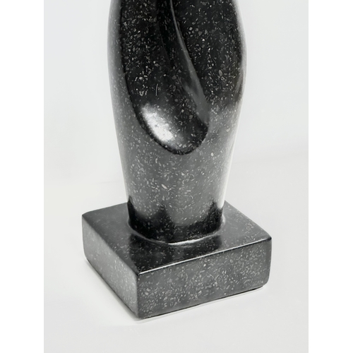 356H - A large Basalt figure in the manner of Henry Moore. 14.5x13x62cm