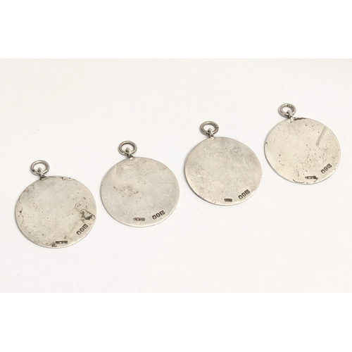 641B - A collection of 4 Irish silver Oireactas pendants. Dublin, 1945. 36.8g