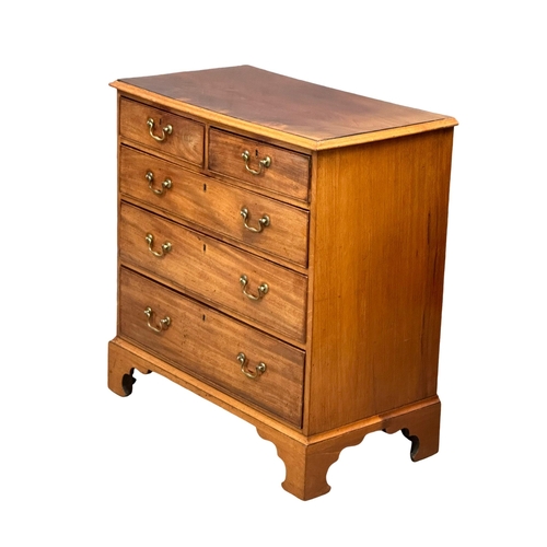 932 - A fine proportioned George III mahogany chest of drawers with original brass drop handles and bracke... 