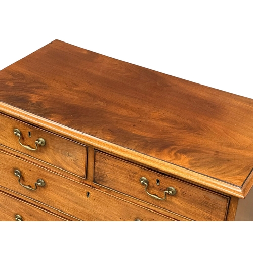 932 - A fine proportioned George III mahogany chest of drawers with original brass drop handles and bracke... 