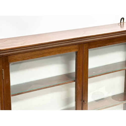 356R - An Edwardian wall hanging/tables top double door display cabinet. 83x16x60cm