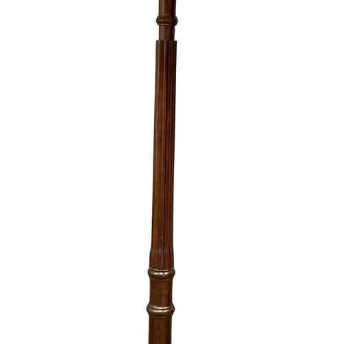 1173 - A vintage Mahogany standard lamp.