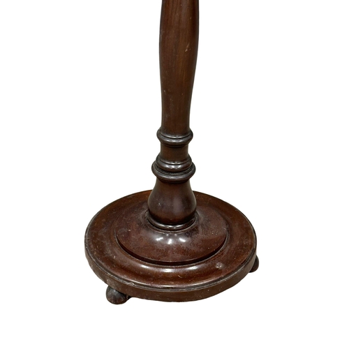 1173 - A vintage Mahogany standard lamp.