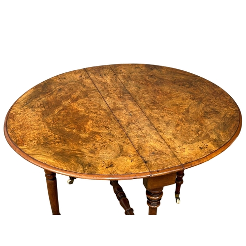 1174 - A large Victorian Burr Walnut sutherland table on carved base with cabriole legs. 109cmx92cmx73cm. C... 