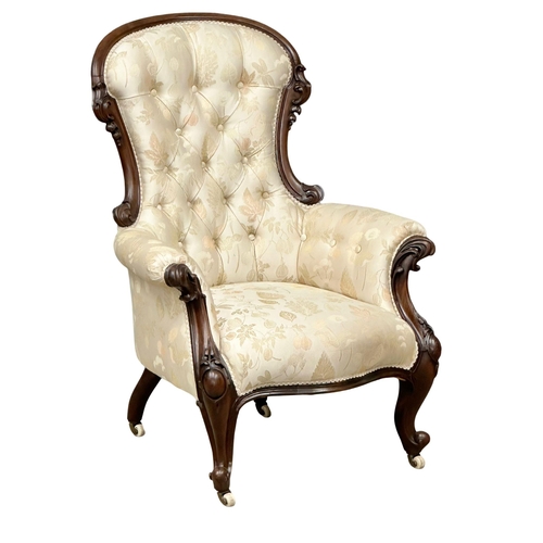 1176 - A large Victorian Mahogany deep buttoned back gents armchair on cabriole legs. Circa 1860