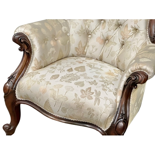 1176 - A large Victorian Mahogany deep buttoned back gents armchair on cabriole legs. Circa 1860