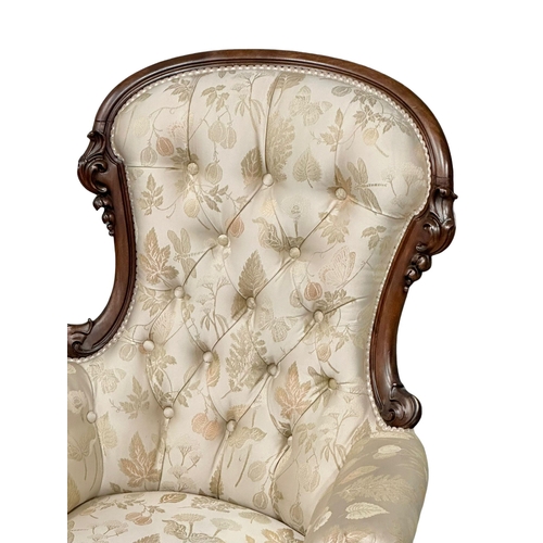 1176 - A large Victorian Mahogany deep buttoned back gents armchair on cabriole legs. Circa 1860