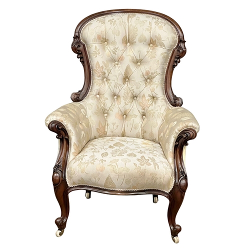 1176 - A large Victorian Mahogany deep buttoned back gents armchair on cabriole legs. Circa 1860