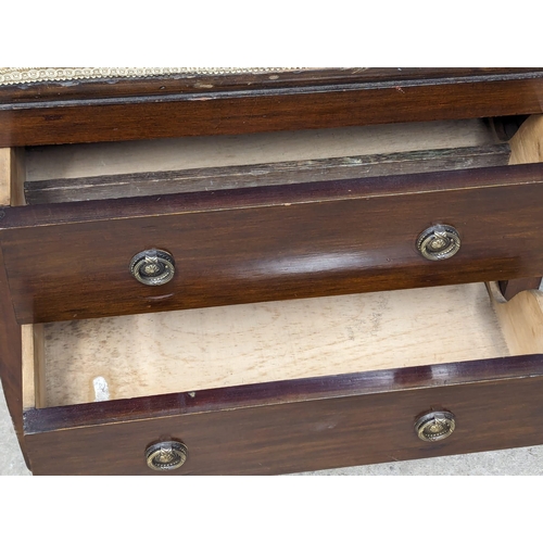 1180 - An Edwardian Mahogany piano stool with two drawers. 58cmx34cmx63cm.