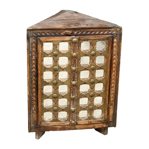 1181 - An early 20th Century Indian Pida chair and corner cabinet