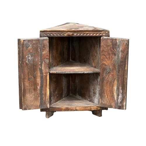 1181 - An early 20th Century Indian Pida chair and corner cabinet