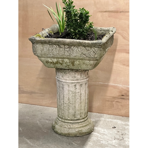 6 - A large concrete garden planter on plinth. 50x50x73cm