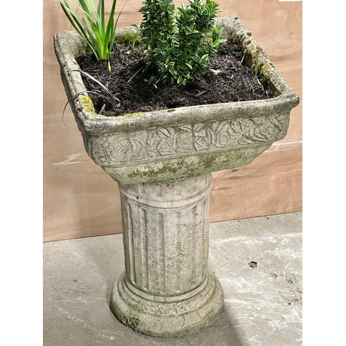 6 - A large concrete garden planter on plinth. 50x50x73cm