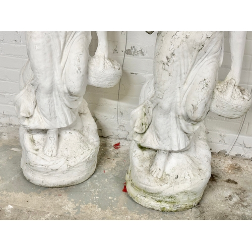 8 - A pair of large concrete garden figures. 135cm