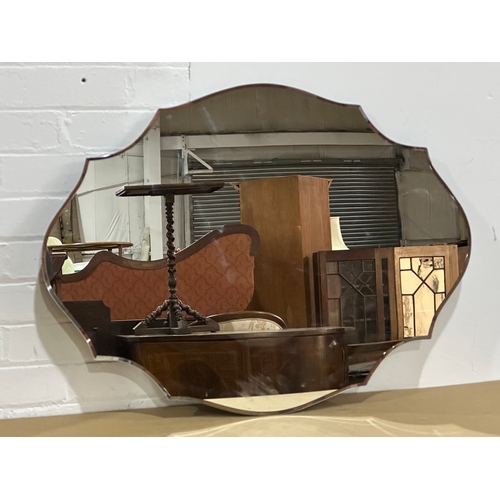 42 - A large Past Times Modern Art Deco style scalloped edge bevelled mirror. 80x60cm