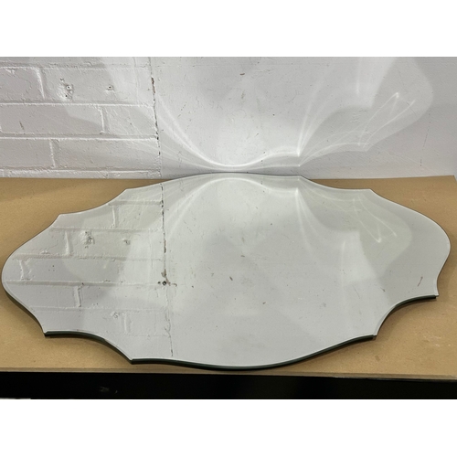 42 - A large Past Times Modern Art Deco style scalloped edge bevelled mirror. 80x60cm