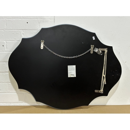 42 - A large Past Times Modern Art Deco style scalloped edge bevelled mirror. 80x60cm