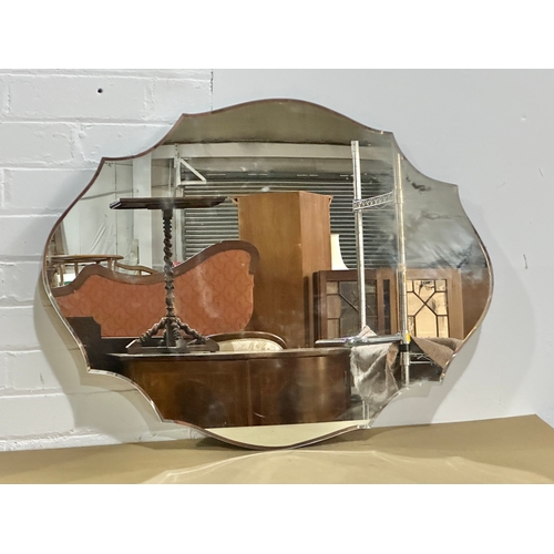 44 - A large Past Times Modern Art Deco style scalloped edge bevelled mirror. 80x60cm