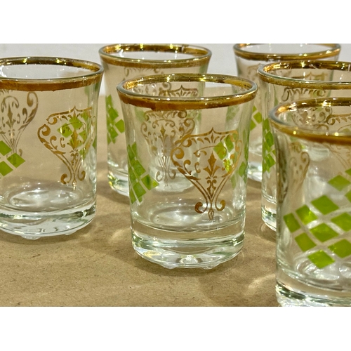 49 - A set of 6 vintage gilt rimmed shot glasses.