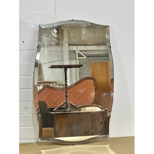 52 - A 1930’s Art Deco bevelled mirror. 74x48cm