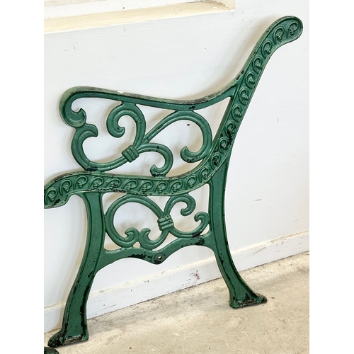 53 - A pair of large cast iron garden bench ends. 67x78cm