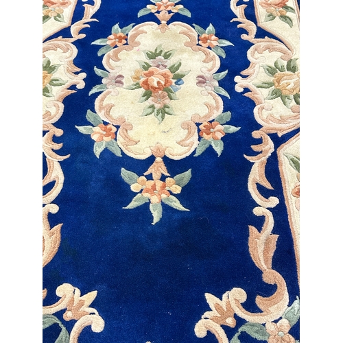 57 - A wool rug. 91x209cm