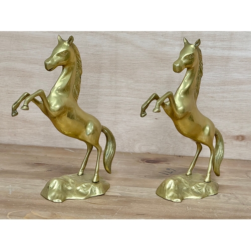 68 - A pair of brass horses. 27cm