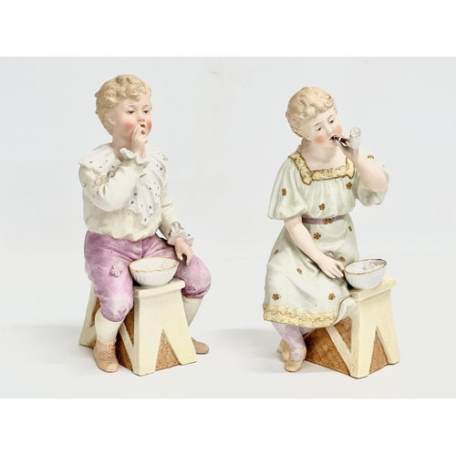 66 - A pair of late 19th century Heubach bisque ‘Bubbles’ figures. Circa 1890. 23cm