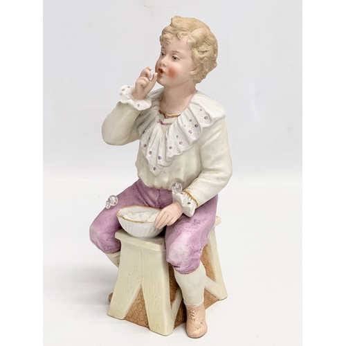 66 - A pair of late 19th century Heubach bisque ‘Bubbles’ figures. Circa 1890. 23cm