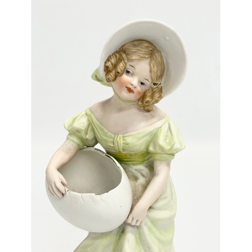 67 - A late 19th century Heubach bisque figurine. 19cm.