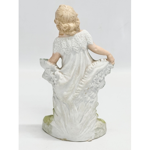 69 - A late 19th century Heubach bisque figurine. 17cm