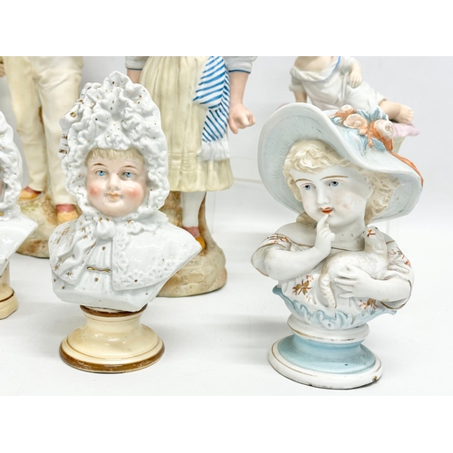 72 - A collection of late 19th century German bisque figurines. Largest pair 32cm