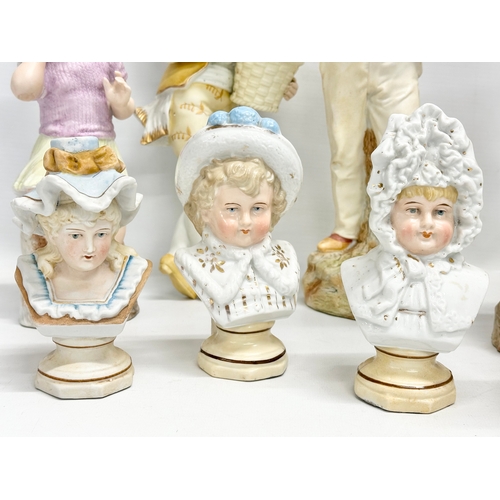 72 - A collection of late 19th century German bisque figurines. Largest pair 32cm