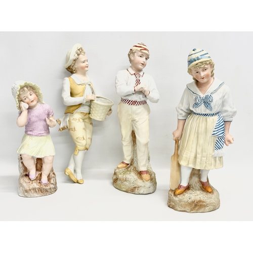 72 - A collection of late 19th century German bisque figurines. Largest pair 32cm