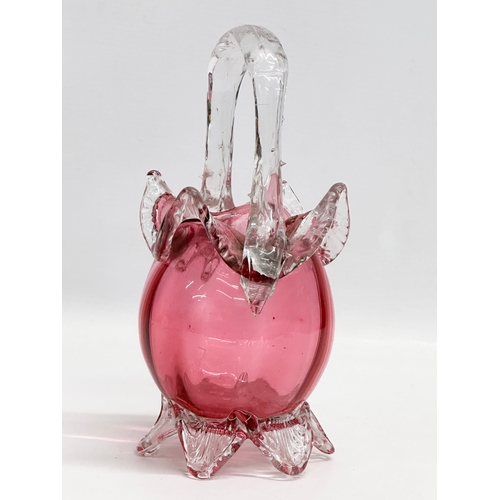 77 - A Victorian Cranberry Glass basket. 23cm