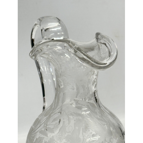 5 - An etched glass pitcher in the manner of William Fritsche. Decorated with leaves, grape vines and bi... 