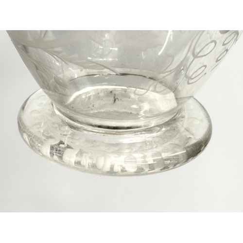 5 - An etched glass pitcher in the manner of William Fritsche. Decorated with leaves, grape vines and bi... 