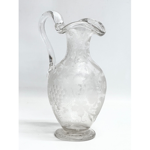 5 - An etched glass pitcher in the manner of William Fritsche. Decorated with leaves, grape vines and bi... 