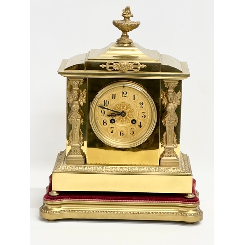 7 - A late 19th century French brass mantle clock on stand. L. Marti Medaille D’Argent 1889. With key an... 