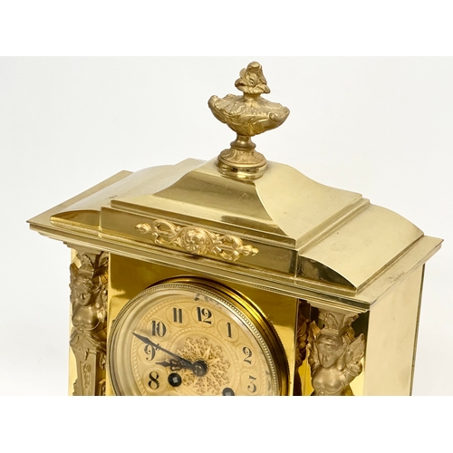 7 - A late 19th century French brass mantle clock on stand. L. Marti Medaille D’Argent 1889. With key an... 