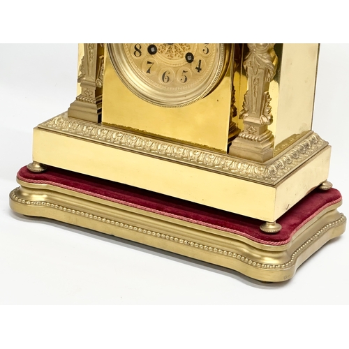 7 - A late 19th century French brass mantle clock on stand. L. Marti Medaille D’Argent 1889. With key an... 