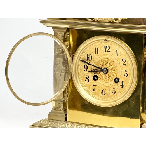 7 - A late 19th century French brass mantle clock on stand. L. Marti Medaille D’Argent 1889. With key an... 