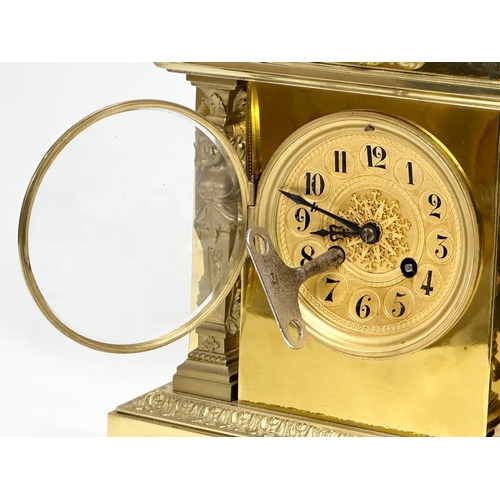 7 - A late 19th century French brass mantle clock on stand. L. Marti Medaille D’Argent 1889. With key an... 