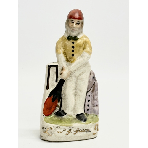 10 - A mid 19th century Staffordshire W. G. Grace ‘Cricket Player’ figure. 14cm