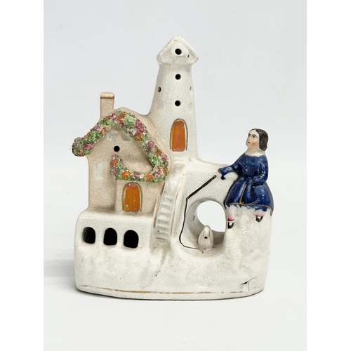 12 - A mid/late 19th century Staffordshire ‘Waiting by the Lighthouse’ figure. 13x16cm